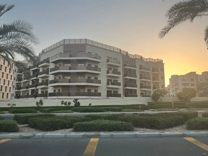 Malak Arjan, a low-rise residential building, at sunset in Dubai